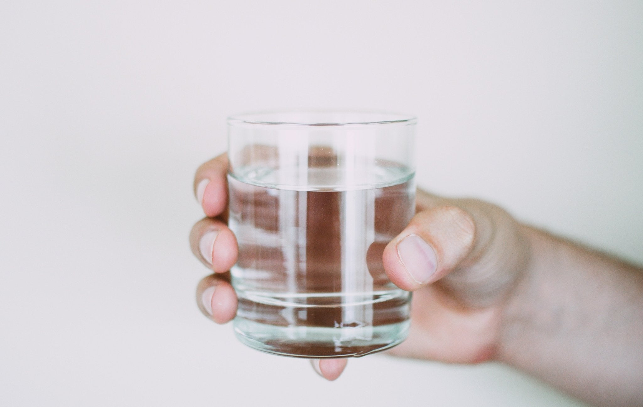 Why You Should Drink Water Before (And After) A Massage - NAIPO